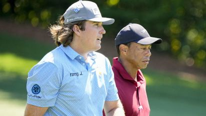 Reuters - Apr 14, 2024; Augusta, Georgia, USA; Neal Shipley talks with Tiger Woods as they walk down No. 11 during the final round of the Masters Tournament. Mandatory Credit: Adam Cairns-USA TODAY Network