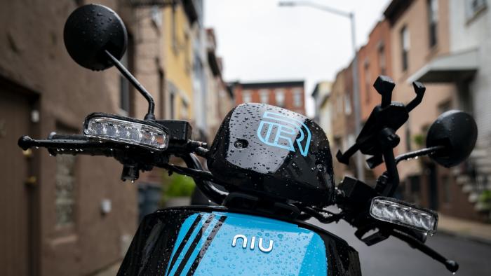 NEW YORK, NY - JUNE 18: A Revel brand moped sits parked on a residential street, June 18, 2019 in the Brooklyn borough of New York City. The ride-share moped company has deployed over 1,000 electric mopeds through Brooklyn and Queens. The fully electric mopeds top out at 30 miles per hour and are available to rent by the minute via smartphone. (Photo by Drew Angerer/Getty Images)