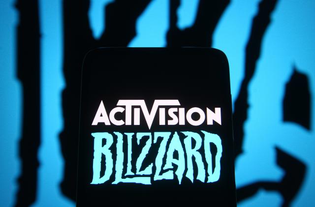 UKRAINE - 2021/06/18: In this photo illustration, Activision Blizzard logo of a video game company is seen on a smartphone screen in front of Blizzard Entertainment logo. (Photo Illustration by Pavlo Gonchar/SOPA Images/LightRocket via Getty Images)