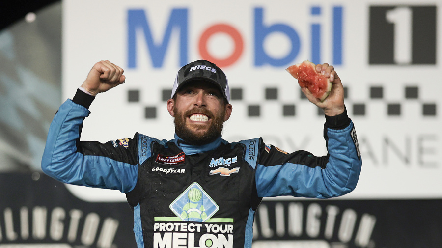 Getty Images - DARLINGTON, SOUTH CAROLINA - MAY 10: Ross Chastain, driver of the #45 Buckle Up South Carolina Chevrolet, celebrates in victory lane after winning the NASCAR Craftsman Truck Series Buckle Up South Carolina 200 at Darlington Raceway on May 10, 2024 in Darlington, South Carolina. (Photo by James Gilbert/Getty Images)