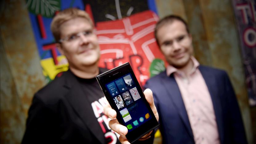 One of the founders of Jolla company, Sami Pienimaki and company's CEO Tomi Pienimaki (R) present the new Jolla smartphone in Helsinki, Finland on May 20, 2013. The phone uses Linux-based Sailfish operating system and it is compatible with Android applications. AFP LEHTIKUVA / Kimmo Mäntyla / FINLAND OUT        (Photo credit should read KIMMO MANTYLA/AFP via Getty Images)