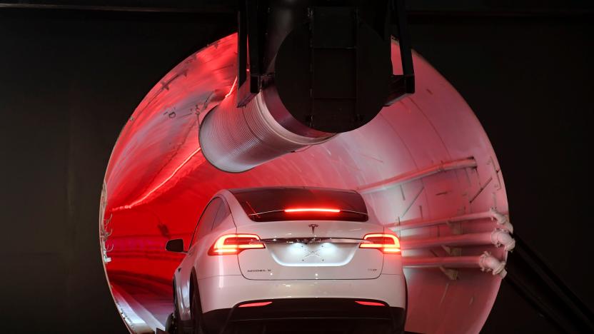 A modified Tesla Model X drives into the tunnel entrance before an unveiling event for the Boring Co. Hawthorne test tunnel in Hawthorne, California, U.S., December 18, 2018. Robyn Beck/Pool via REUTERS