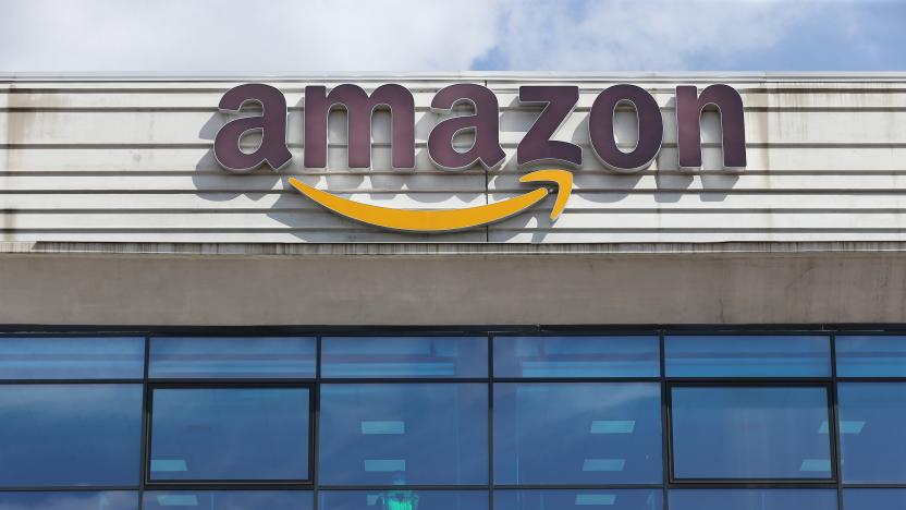 ARZANO, ITALY - 2021/03/22: A view of the Amazon headquarters in Arzano, with a worker behind the windows. On this day, a strike by Amazon workers was proclaimed throughout Italy to protest against the overworked working conditions. (Photo by Marco Cantile/LightRocket via Getty Images)