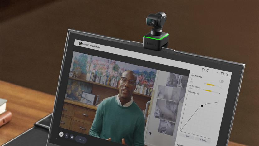 An Insta360 Link webcam attached to the top of a laptop.