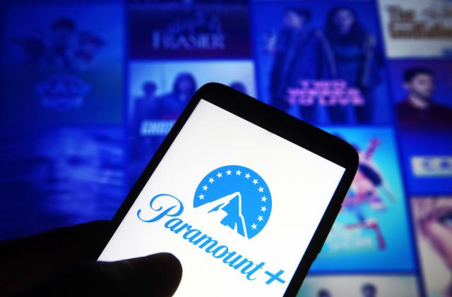 UKRAINE - 2021/06/29: In this photo illustration, Paramount+ (Paramount Plus) logo is seen on a smartphone against its website in the background. (Photo Illustration by Pavlo Gonchar/SOPA Images/LightRocket via Getty Images)