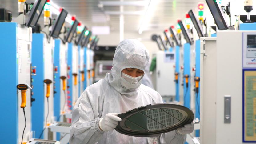 JIASHAN, CHINA - MAY 25: Employees work on the production line of silicon wafer at a factory of GalaxyCore Inc. on May 25, 2021 in Jiashan County, Jiaxing City, Zhejiang Province of China. (Photo by Guo Junfeng/VCG via Getty Images)