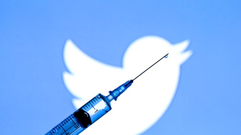 SPAIN - 2021/03/03: In this photo illustration a medical syringe seen displayed in front of the Twitter logo. (Photo Illustration by Thiago Prudêncio/SOPA Images/LightRocket via Getty Images)