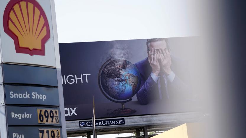 Gasoline prices are displayed at a Shell gas station in front of a billboard advertising HBO's "Last Week Tonight with John Oliver" in Los Angeles, California, U.S., March 10, 2022. Picture taken March 10, 2022. REUTERS/Bing Guan