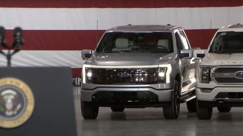 DEARBORN, MI. MAY 18, 2021 President Joe Biden spoke today at the Rouge Electric Vehicle Center in Dearborn, Mich., manufacturing home of the all-new, all-electric Ford F-150 Lightning that goes on sale in mid-2022. The F-150 Lightning will be officially revealed Wednesday, May 19, 2021, at 9:30 p.m. EDT. Pictured (left to right): Jim Farley, CEO, Ford Motor Company, Bill Ford, executive chairman, Ford Motor Company, President Joe Biden, Kumar Galhotra, president, Americas & International Markets Group for Ford Motor Company.  Photo by Sam VarnHagen.

 