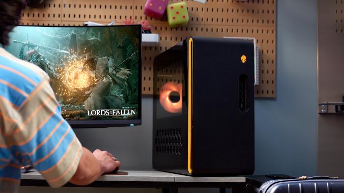A guy playing a game on his new gaming PC.