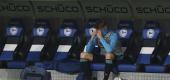 Schalke defender Timo Becker sits alone on the bench. (AP)