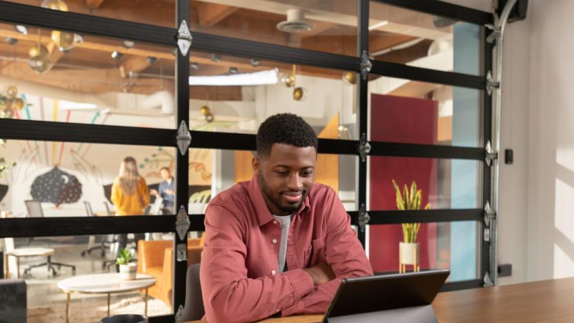 A person looking at a Microsoft Surface