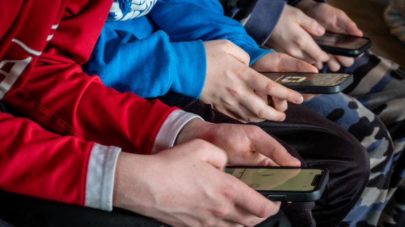 MORZINE, FRANCE - APRIL 08: Three teenage boys looks at their smartphone screens in village of St Jean d'Aulps on April 8, 2024 near Morzine, France.
Following the lead of the EU Commission and several US administrations, TikTok is set to be banned from UK government phones amid security concerns around the Chinese-owned video app. Recently TikTok announced that every account belonging to a user below age 18 have a 60-minute daily screen time limit automatically set. (Photo by Matt Cardy/Getty Images)