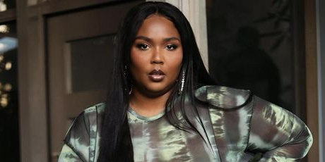 Lizzo just played basketball with an actual designer bag