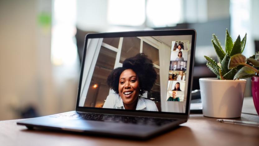 Shot of african businesswoman having a video call on a laptop with her team. Woman having meeting on video call on laptop with diverse colleagues,