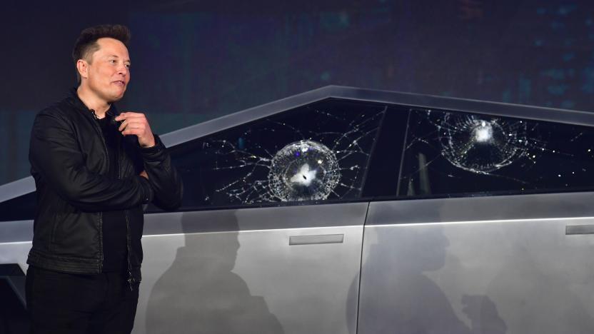 Tesla co-founder and CEO Elon Musk verbally reacts in front of the newly unveiled all-electric battery-powered Tesla Cybertruck with broken glass on windows following a demonstation that did not go as planned on November 21, 2019 at Tesla Design Center in Hawthorne, California. (Photo by Frederic J. BROWN / AFP) (Photo by FREDERIC J. BROWN/AFP via Getty Images)