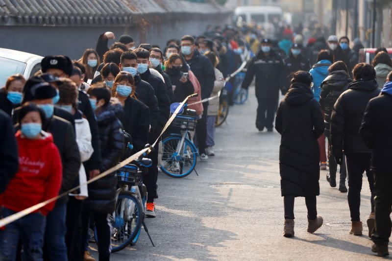 Long lines as China’s capital launches massive virus tests