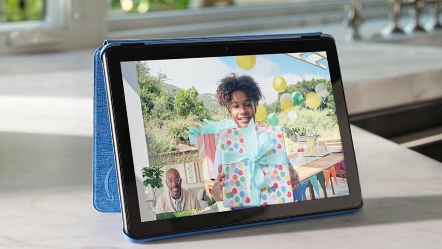 A tablet on a counter showing a photo of a little girl. 