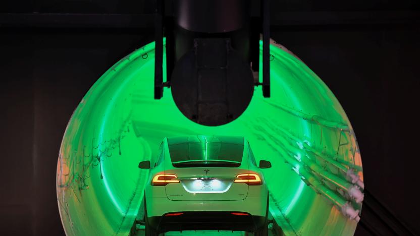 A modified Tesla Model X electric vehicle enters a tunnel during an unveiling event for the Boring Co. Hawthorne test tunnel in Hawthorne, California, U.S., December 18, 2018.        Robyn Beck/Pool via REUTERS