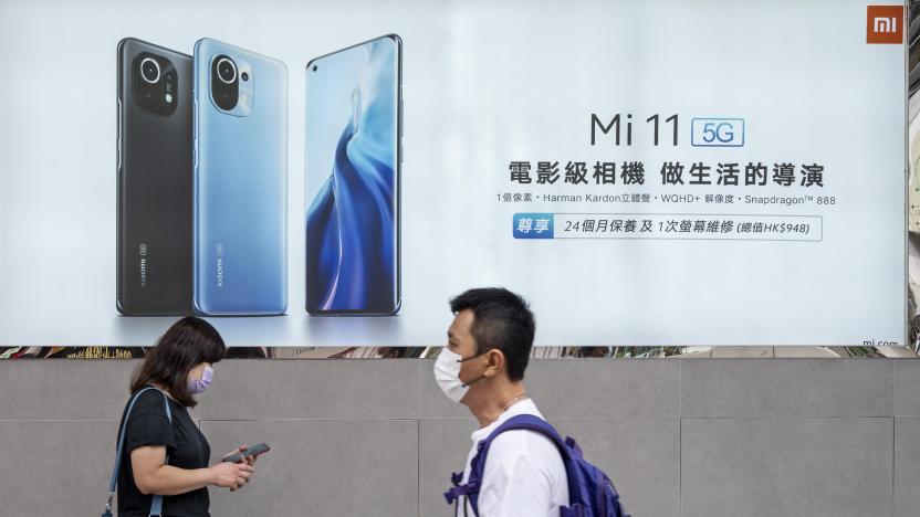 HONG KONG, CHINA - 2021/03/31: Pedestrians walk past the Xiaomi Mi 11 5G smartphone advertisement at its flagship store in Hong Kong. (Photo by Budrul Chukrut/SOPA Images/LightRocket via Getty Images)