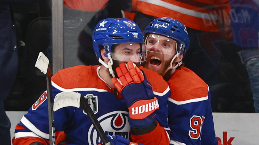 Getty Images - EDMONTON, ALBERTA - JUNE 21: Connor McDavid #97 and Adam Henrique #19 of the Edmonton Oilers celebrate their win over the Florida Panthers during the third period of Game Six of the 2024 Stanley Cup Final at Rogers Place on June 21, 2024 in Edmonton, Alberta.  (Photo by Jeff Vinnick/Getty Images)