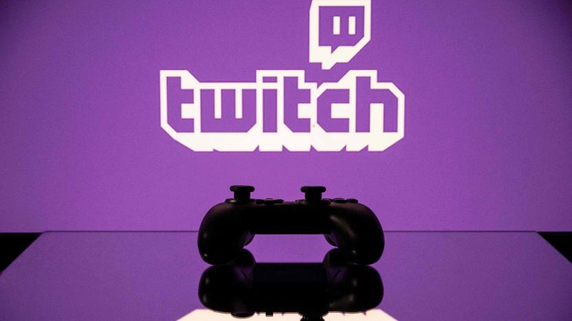 A gamepad is pictured as a screen displays the online Twitch plateform in Toulouse, southwestern France, on June 15, 2021. (Photo by Lionel BONAVENTURE / AFP) (Photo by LIONEL BONAVENTURE/AFP via Getty Images)