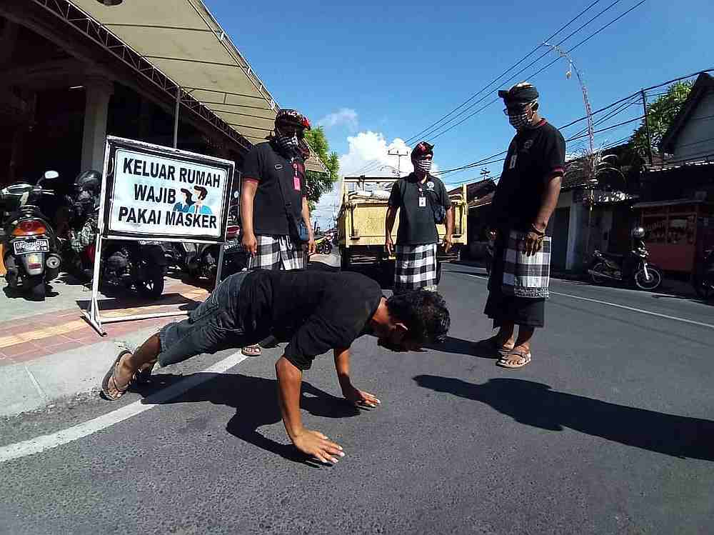  Covid  19 Bali  local authorities punish face mask 