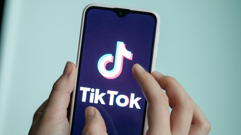 13 November 2019, Berlin: ILLUSTRATION - A girl is holding her smartphone with the logo of the short video app TikTok in her hands. With TikTok, users can create short mobile phone videos to music clips or other videos. Other users can comment on it, distribute hearts or react in any other way. Private messages are also possible. The app is particularly popular with young people. Photo: Jens Kalaene/dpa-Zentralbild/dpa (Photo by Jens Kalaene/picture alliance via Getty Images)