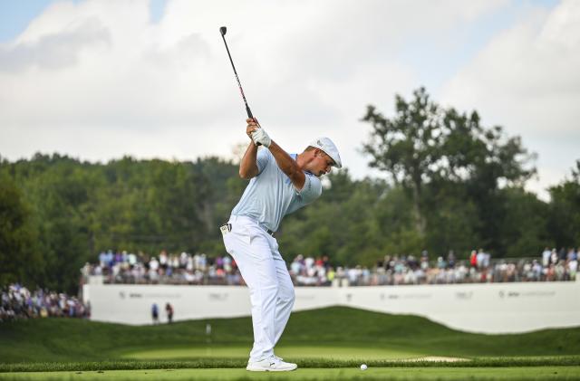 OWINGS MILLS, MD - AUGUST 28:  Bryson DeChambeau at the top of his swing as he plays his shot from the 13th hole drop zone after hitting his tee shot in the water during the third round of the BMW Championship, the second event of the FedExCup Playoffs, at Caves Valley Golf Club on August 28, 2021 in Owings Mills, Maryland. (Photo by Keyur Khamar/PGA TOUR via Getty Images)