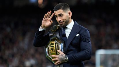 Getty Images - MADRID, SPAIN - FEBRUARY 25: Ilia Topuria, UFC Featherweight Champion, is seen with his belt on the pitch prior to the LaLiga EA Sports match between Real Madrid CF and Sevilla FC at Estadio Santiago Bernabeu on February 25, 2024 in Madrid, Spain. (Photo by Angel Martinez/Getty Images)