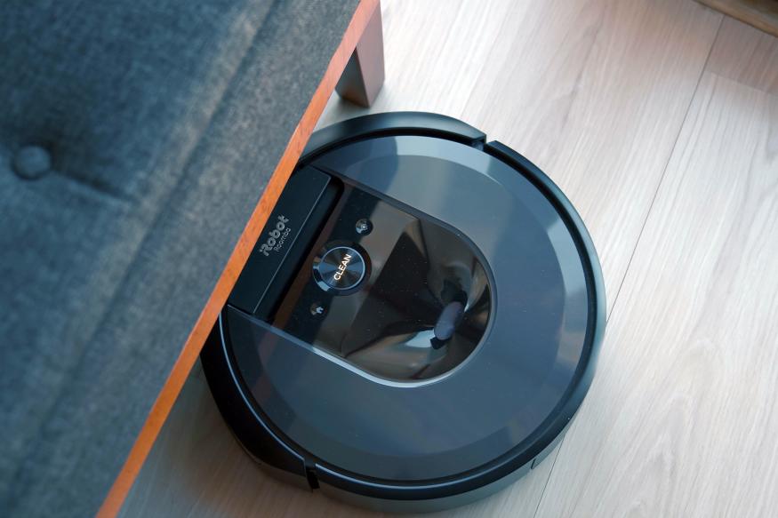 iRobot Roomba vacuum under a chair