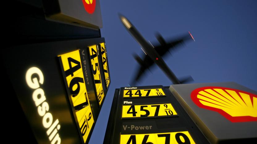 Gasoline prices are advertised at a gas station near Lindbergh Field as a plane approaches to land in San Diego, California June 1, 2008. REUTERS/Mike Blake      (UNITED STATES)