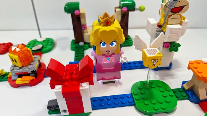 An overhead view of pieces from the Lego Super Mario Bros. Peach set, laid out and interconnected.