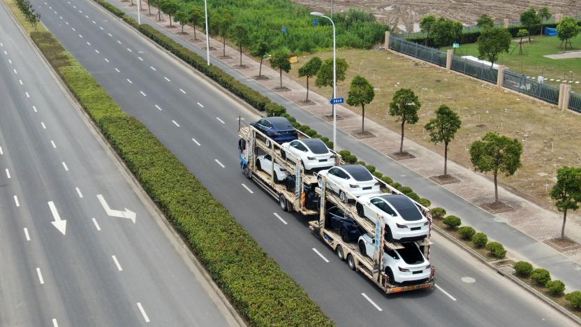 SHANGHAI, CHINA - JULY 11: Aerial view of new-energy vehicles sitting on a truck at Tesla Shanghai Gigafactory of Lingang New Area on July 11, 2021 in Shanghai, China. (Photo by VCG/VCG via Getty Images)