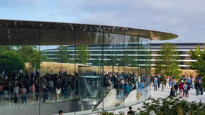 People walk through the Steve Jobs Theater prior to an event at the Apple Park campus in Cupertino, California, on September 12, 2023. The new Apple iPhone 15, with EU ordered USB-C charger, is expected to be announced, amongst other new products, during a launch event on September 12. (Photo by Nic Coury / AFP) (Photo by NIC COURY/AFP via Getty Images)