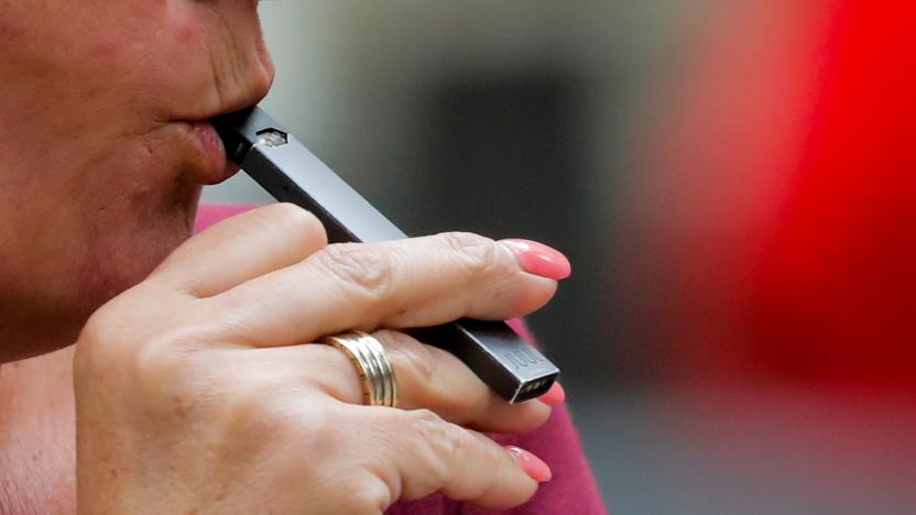 A woman smokes a Juul e-cigarette in New York, U.S., September 27, 2018.  REUTERS/Brendan McDermid