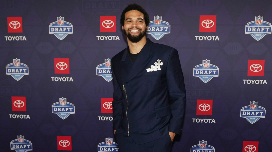 Associated Press - Southern California quarterback Caleb Williams poses on the red carpet ahead of the first round of the NFL football draft, Thursday, April 25, 2024, in Detroit. (AP Photo/Carlos Osorio)