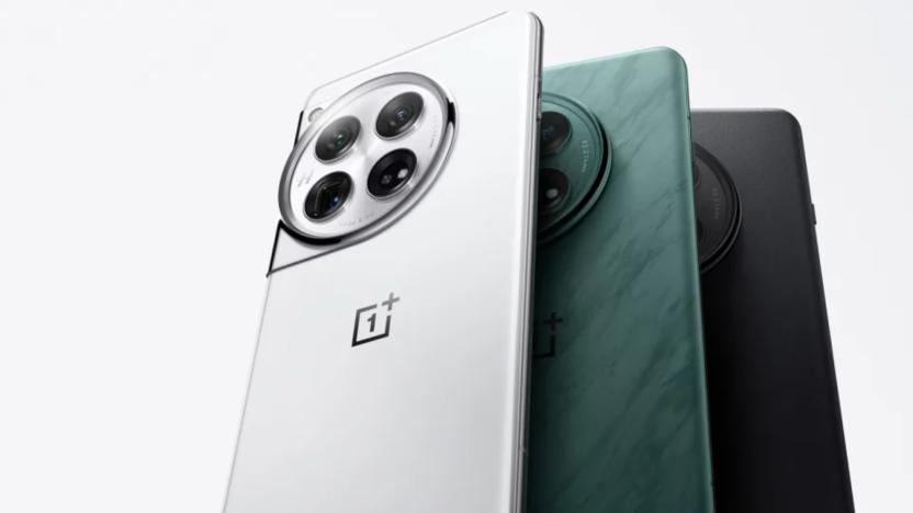 A trio of OnePlus 12 phones in different colors.