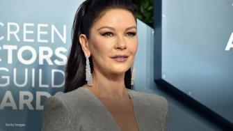 Catherine Zeta-Jones, 51, sports a striped bikini to show off her hula hoop skills