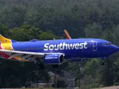 Southwest ditches open seating, Delta recovers from outages