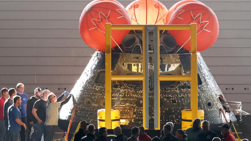 NASA engineers inspect the Orion Capsule in the well deck of the U.S.S. Portland the day after splash down, following a successful uncrewed Artemis I Moon Mission, on December 12, 2022 seen aboard the U.S.S. Portland in the Pacific Ocean off the coast of California, U.S. The 26-day mission took the Orion spacecraft around the moon and back, completing a historic test flight coinciding with the 50th anniversary of the landing of Apollo 17 on the moon, the last time NASA astronauts walked there. Mario Tama/Pool via REUTERS