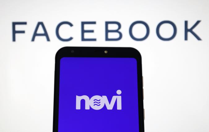 ANKARA, TURKEY -  MAY 27: In this illustration photo, the logo of "Novi" is displayed on a smartphone as "Facebook" logo is seen behind, in Ankara, Turkey on May 27, 2020. (Photo by Hakan Nural/Anadolu Agency via Getty Images)