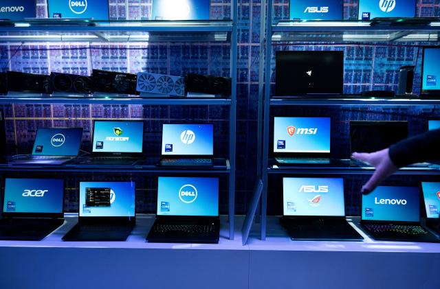 Laptop computers using Intel chips are shown at an Intel exhibit before this week's Consumer Electronics Show (CES), January 8, 2024, in Las Vegas, Nevada. (Photo by Brendan Smialowski / AFP) (Photo by BRENDAN SMIALOWSKI/AFP via Getty Images)