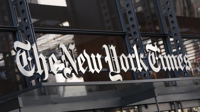 FILE - A sign for The New York Times hangs above the entrance to its building on May 6, 2021 in New York. The New York Times Co. is buying sports site The Athletic for $550 million, drilling down on subscriptions as the newspaper print ads business fades.  The Athletic covers national and local sports â more than 200 teams, according to the Times' press release. (AP Photo/Mark Lennihan, File)