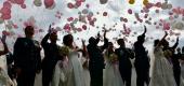 Newly wedded couples release balloons in a mass wedding at Taiwan's Army Command Headquarters in Taoyuan on Oct. 30, 2020. (Sam Yeh/AFP via Getty Images) 