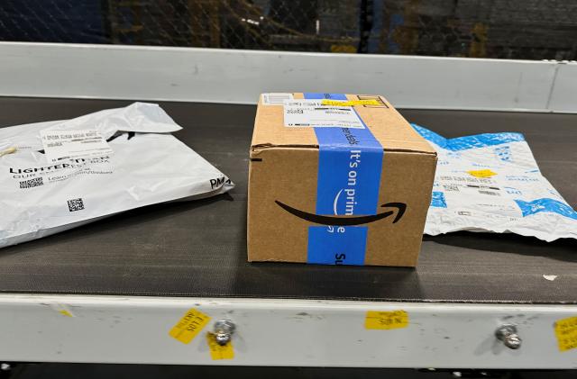 Packages are transported on a conveyor belt at the Amazon warehouse, busy on Prime Day, in Melville, New York, U.S., June 11, 2023. REUTERS/Soren Larson