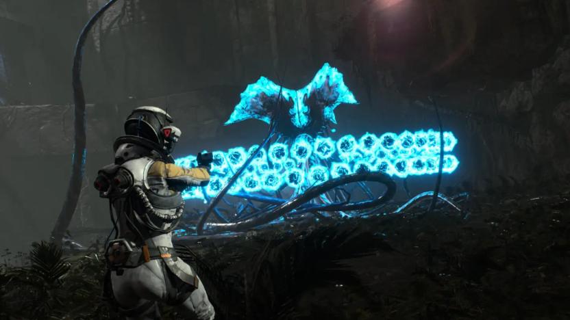 A screenshot from Returnal, in which Selene faces a creature that's firing a volley of bullets toward her.