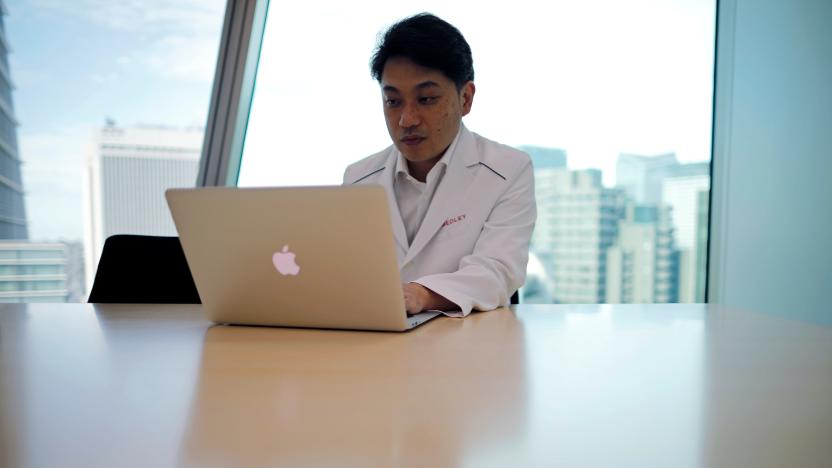 Medical doctor Makoto Kitada demonstrates a telemedicine application service called 'CLINICS', developed by Japanese medical start-up Medley Inc., in Tokyo, Japan, July 8, 2020. Picture taken July 8, 2020.  REUTERS/Issei Kato