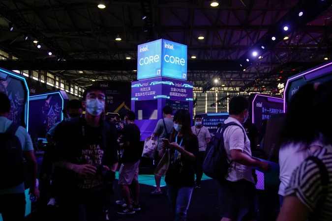 Visitors are seen at the Intel booth during the China Digital Entertainment Expo and Conference, also known as ChinaJoy, in Shanghai, China July 30, 2021. Picture taken July 30, 2021. REUTERS/Aly Song