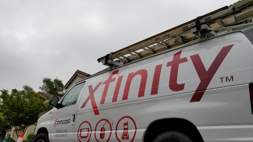 San Ramon, California, United States - May 17, 2018:  Low angle view of Comcast Xfinity cable television installation truck parked on a street in front of a suburban home, San Ramon, California, May 17, 2018